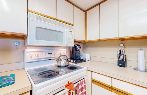 Shelter Cove Villa | Charming bay view villa with pool, washer/dryer, balcony, TV, & full kitchen