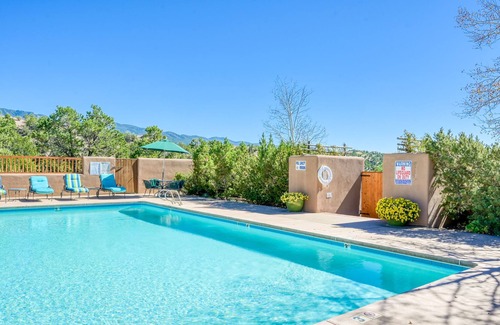 Nambe Pueblo Apartamento | Charming condo with fireplace, patio, grill, W/D, & pool - quiet location