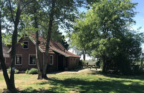 Den Ham Casa | Acogedora casa de vacaciones en Twenterand con vistas al prado