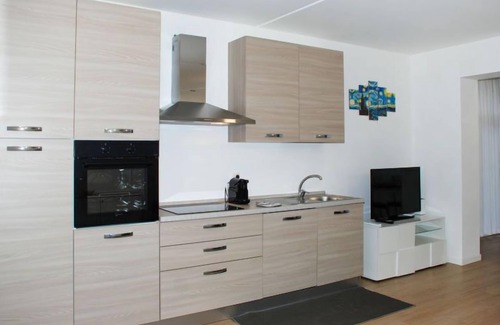 Bissone Apartamento | Charming Gardenview App. 105 by Interhome