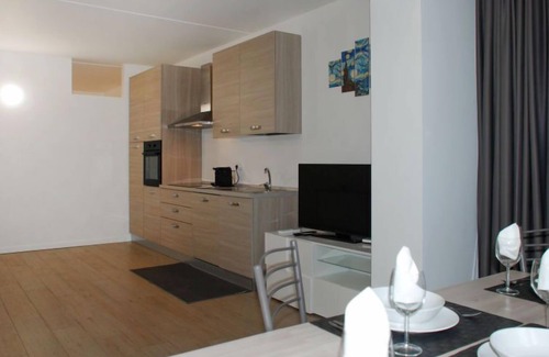 Bissone Apartamento | Charming Gardenview App. 105 by Interhome