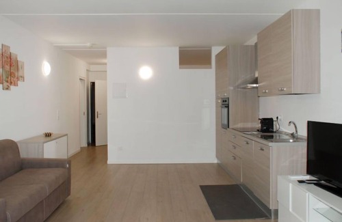 Bissone Apartamento | Charming Gardenview App. 105 by Interhome