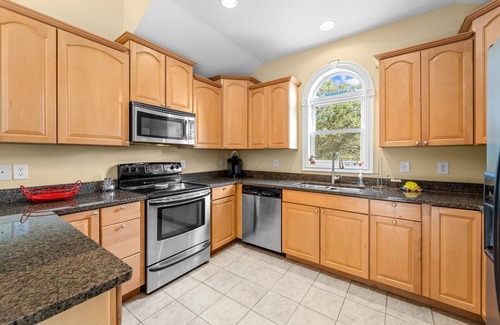 Southern Shores Casa | Charming home with wraparound balcony, central AC, full kitchen, & W/D