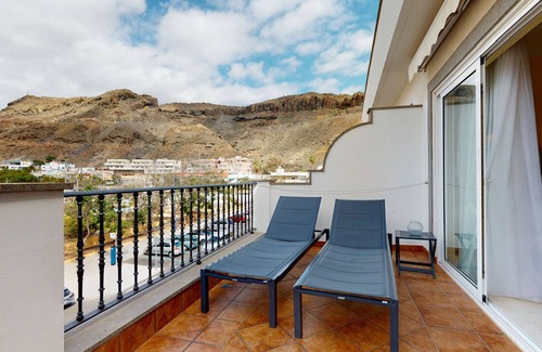 Playa de Mogan Condominio | Encantador y moderno apartamento con terraza, directamente en el mar, wifi gratis