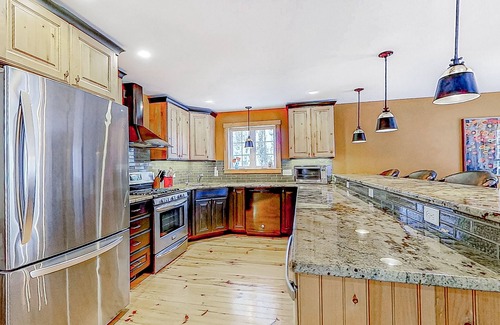 Alton Bay Casa | Charming & sun-filled nature escape with large deck, wood stove, fire pit, & W/D
