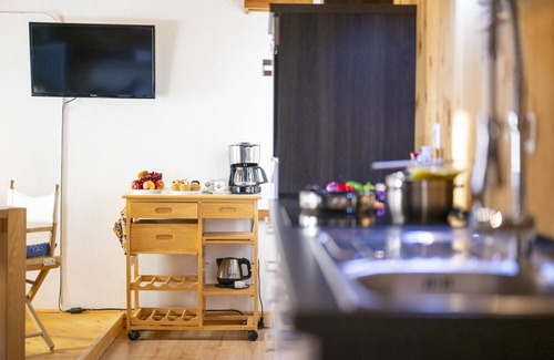 Valsot Apartamento | Chasa Patgific: Cozy 3-Room Holiday Apartment with Wood Stove and Stunning Garden in Ramosch