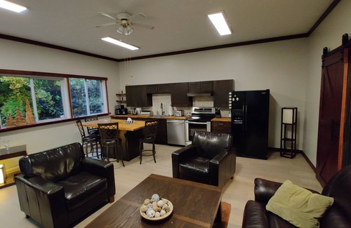 Black Creek Casa | Cheerful 2-bedroom bungalow with a view to a magical fairytale house