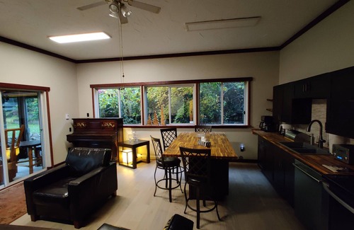 Black Creek Casa | Cheerful 2-bedroom bungalow with a view to a magical fairytale house