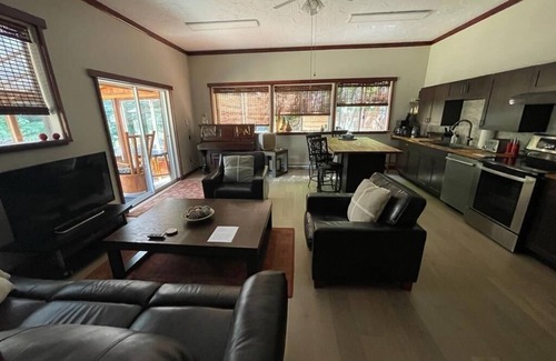 Black Creek Casa | Cheerful 2-bedroom bungalow with a view to a magical fairytale house