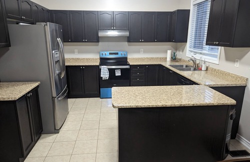Alcona Casa | Cheerful 4 Bedroom house with indoor fireplace
