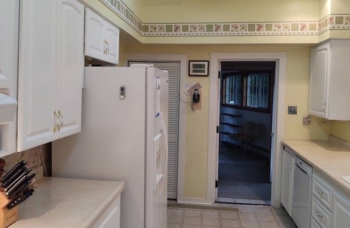 Lake Leelanau Cabaña | Classic 1920 cottage on huge lot with boat dock, fire pit patio, beautiful views