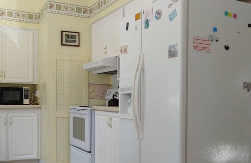 Lake Leelanau Cabaña | Classic 1920 cottage on huge lot with boat dock, fire pit patio, beautiful views
