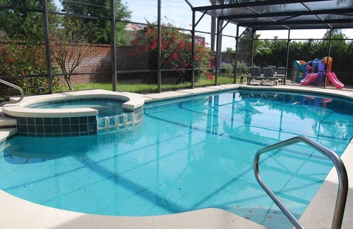 West Kissimmee Casa | CERCA DE Disney * ENORME piscina / spa * GameRm * WiFi gratis * Patio privado, habitaciones temáticas
