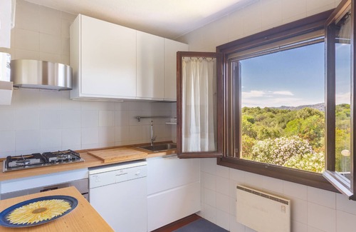 Porto San Paolo Apartamento | Cerca de la playa, apartamento para 7 personas con vista a la bahía de la isla de Tavolara, WiFi rápido.