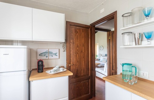 Porto San Paolo Apartamento | Cerca de la playa, apartamento para 7 personas con vista a la bahía de la isla de Tavolara, WiFi rápido.