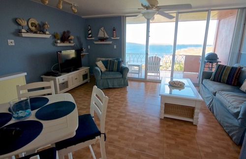 Cotton Valley Condominio | Venga a disfrutar de la increíble vista de las azules aguas del Caribe y la famosa Isla Buck