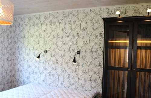 Vackelsang Casa | Comfort holiday home with lake location, motor boat and pool