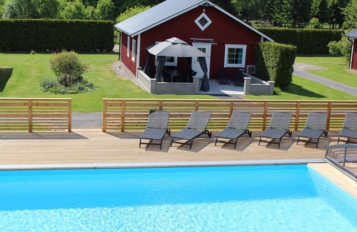 Vackelsang Chalet De Esquí | Comfort holiday home with lake location, motor boat and pool
