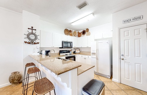 Frangista Beach Condominio | Comfortable ground floor condo with pool & hot tub access, W/D, WiFi, and AC