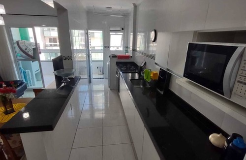 Praia Grande Apartamento | Complete apartment with sea view, 1 block from the beach and 1 parking space
