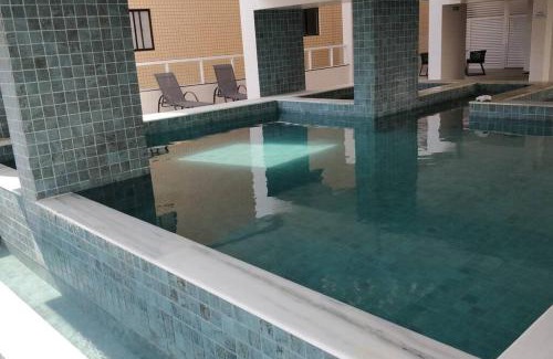 Caicara Apartamento | condominio clube com piscina climatizada com fechamento em vidro - Vila Caiçara - Praia Grande 4 adultos e 1 criança até 12 anos