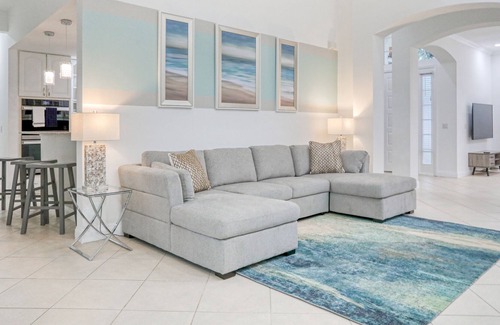 Ridgewood Lakes Casa | Corner lot home with screened pool + spa, game room, on-site golf, AC, & WiFi