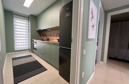 Stefanestii de Jos Apartamento | Cosmopolis Family Apartment - Pools & Gym