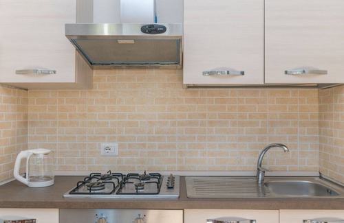 Capo Testa Apartamento | Bonito apartamento para 4 personas con A/C, TV, terraza, mascotas permitida y aparcamiento