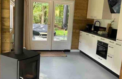 Zon en Schild Casa | Cosy wooden house with hot tub in forest