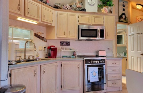 Upper Grand Lagoon Casa | Cottage on Lake in a Gated Resort Property Near Beaches & Entertainment
