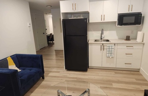 Dieppe Casa | Cozy Basement Apartment with Private Entrance and Office space-4 Mins to Airport