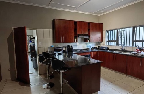 Matsapha Casa | Cozy bedroom ensuite, fully equipped retreat.