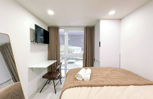 Tan Qui Dong Apartamento | Cozy budget room in D7 with chill rooftop