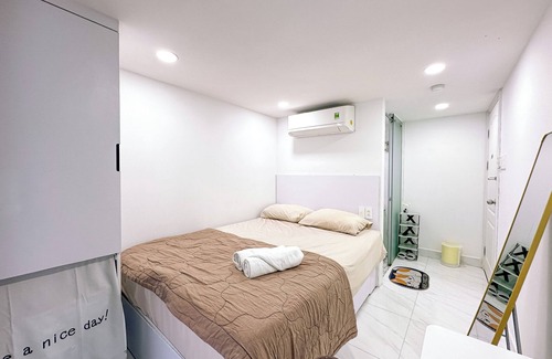 Tan Qui Dong Apartamento | Cozy budget room in D7 with chill rooftop
