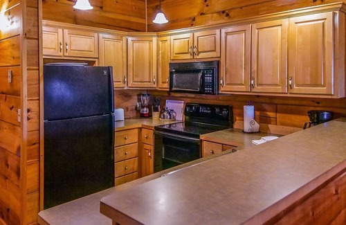 Spencer Cabina | Cozy cabin with fire pit, hot tub, and pool, and a swing set in the backyard!