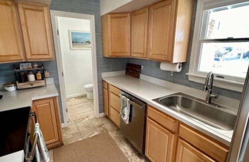 Colington Harbour Casa | Cozy Cottage on the Canal (Hot Tub, Kayaks & Pool)