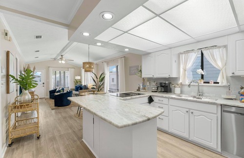 Lower Grand Lagoon Cabaña | Cozy family vacation in Panama City Beach with golf cart ,private beach, pools