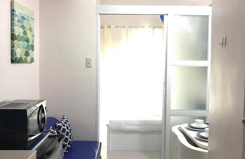 Silang Junction South Condominio | Acogedora unidad griega elegante 1BR en Tagaytay - Aneto Meros