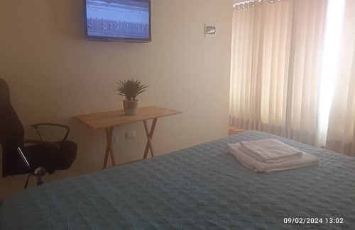 Puno Casa | Cozy room with TV and private bathroom