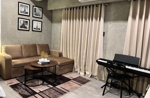 Kaunlaran Apartamento | Cozy Spacious Hotel Type Condo with PS5 Smart TV and WiFi