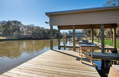 Cedar Lane Casa | Creekfront Cottage w/ Boat Lift & Pier