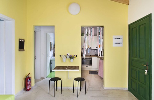 Almiros Beach Casa | Cute yellow Handmade House with tree garden