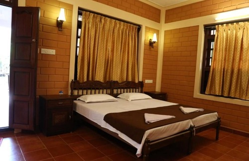 Alappuzha Cama Y Desayuno | Dazzle Dew Memories -Standard Room 1