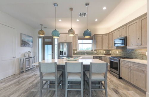 Sanibel Casa | DEJA BLUE | Lux Canal-Front Sanibel Home with Saltwater Pool and View