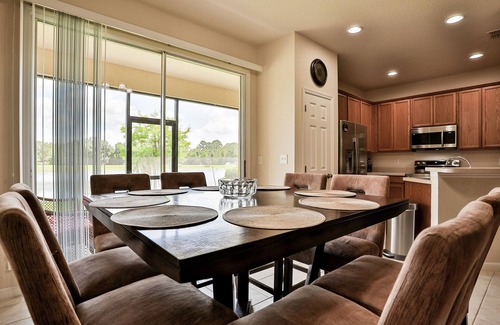 Trafalgar Village Casa | Delightful lakefront townhome with pool, volleyball, fast WiFi & AC
