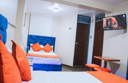 Santiago de Surco Apartamento | Deluxe Queen Room with Two Queen Beds 4