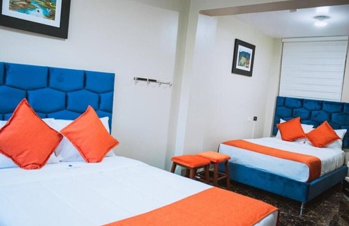 Santiago de Surco Apartamento | Deluxe Queen Room with Two Queen Beds 4