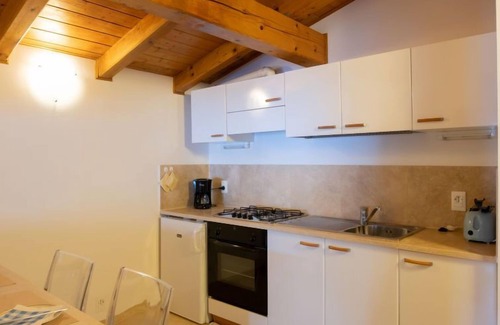 Magugnago Apartamento | Apartamento Delvai en Brenzone - 2 personas, 1 dormitorios