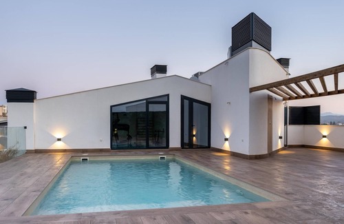 Santiago y Zaraiche Apartamento | Apartamento de diseño para 2 personas con piscina comunitaria y gimnasio.