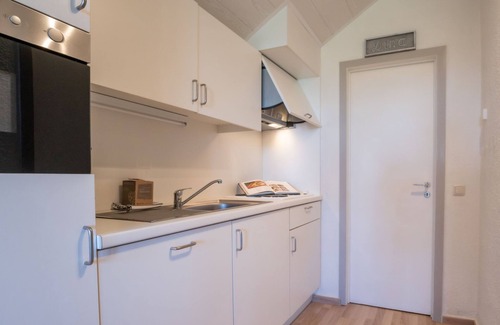 De Haan Apartamento | Dina with parking and shared pool by Interhome